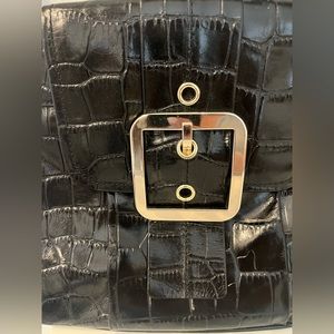 Black leather handbag with shoulder strap